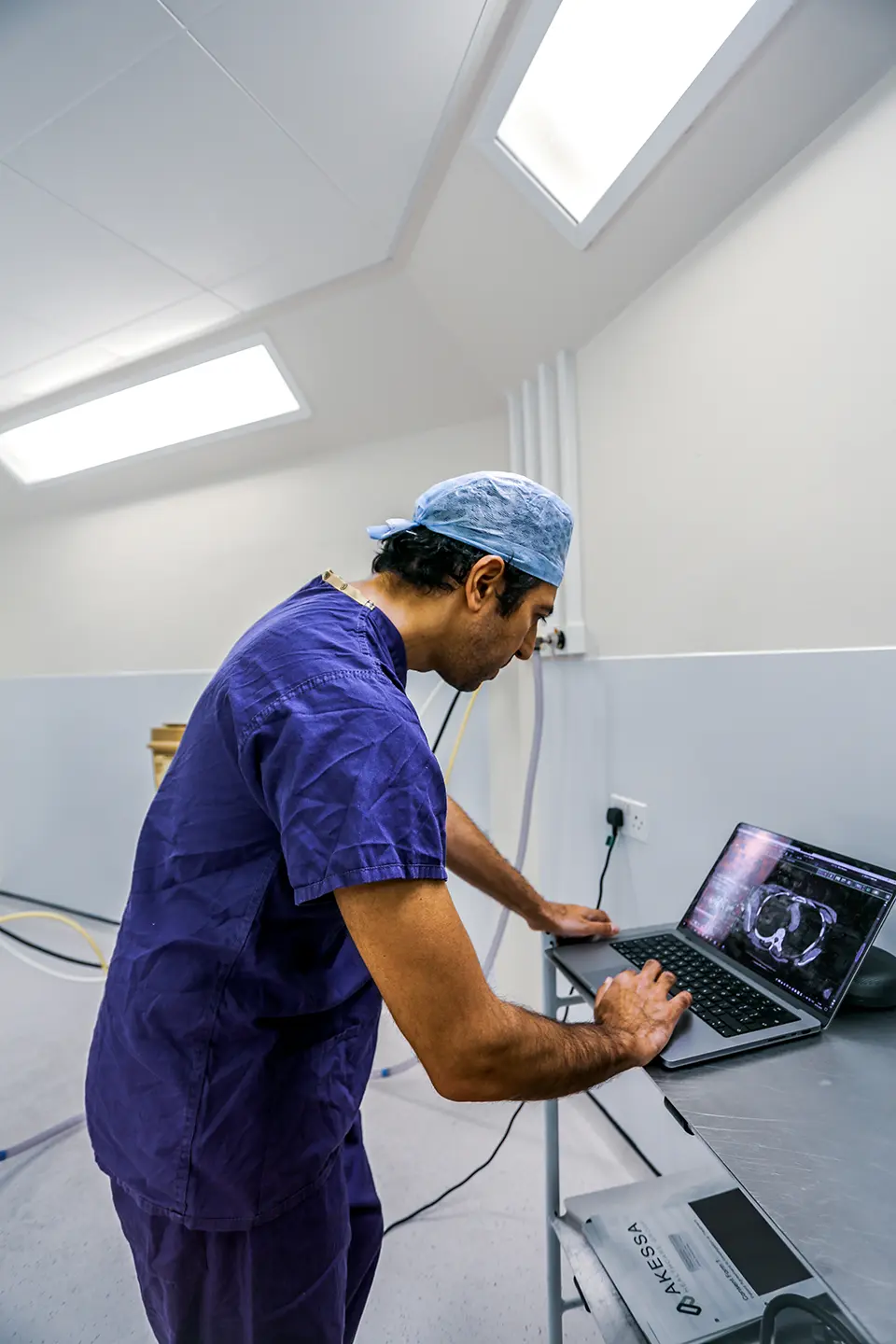 Mr Shad Khan reviewing scan before endocrine operation